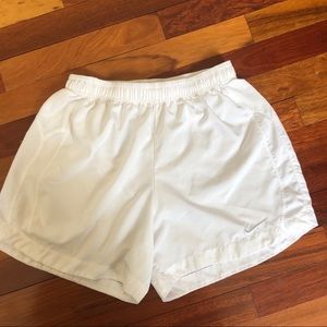 White Nike running shorts